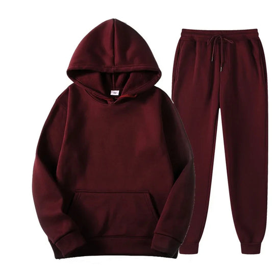 A comfortable, warm and loose two-piece set of casual wool hoodie and sport pants for men and women in winter 2025